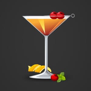 Martini glass with cherries and an orange peel